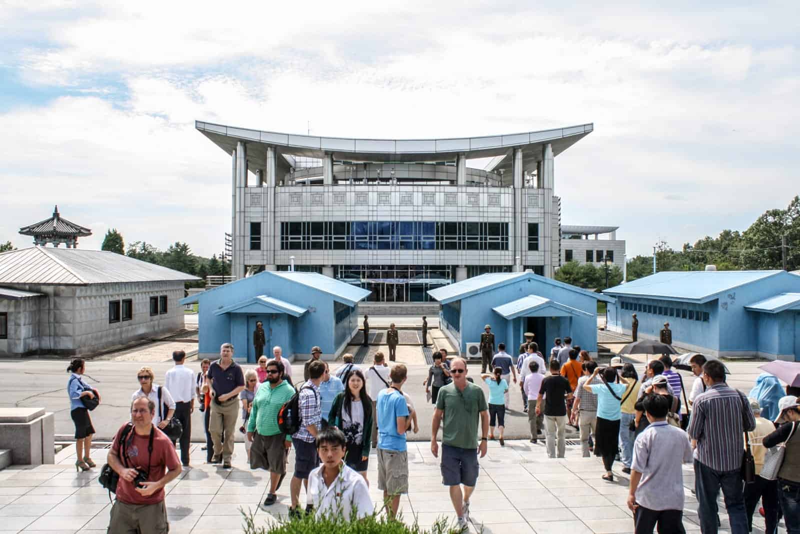 Travellers visit the DMZ on the North Korea side on a guided tour