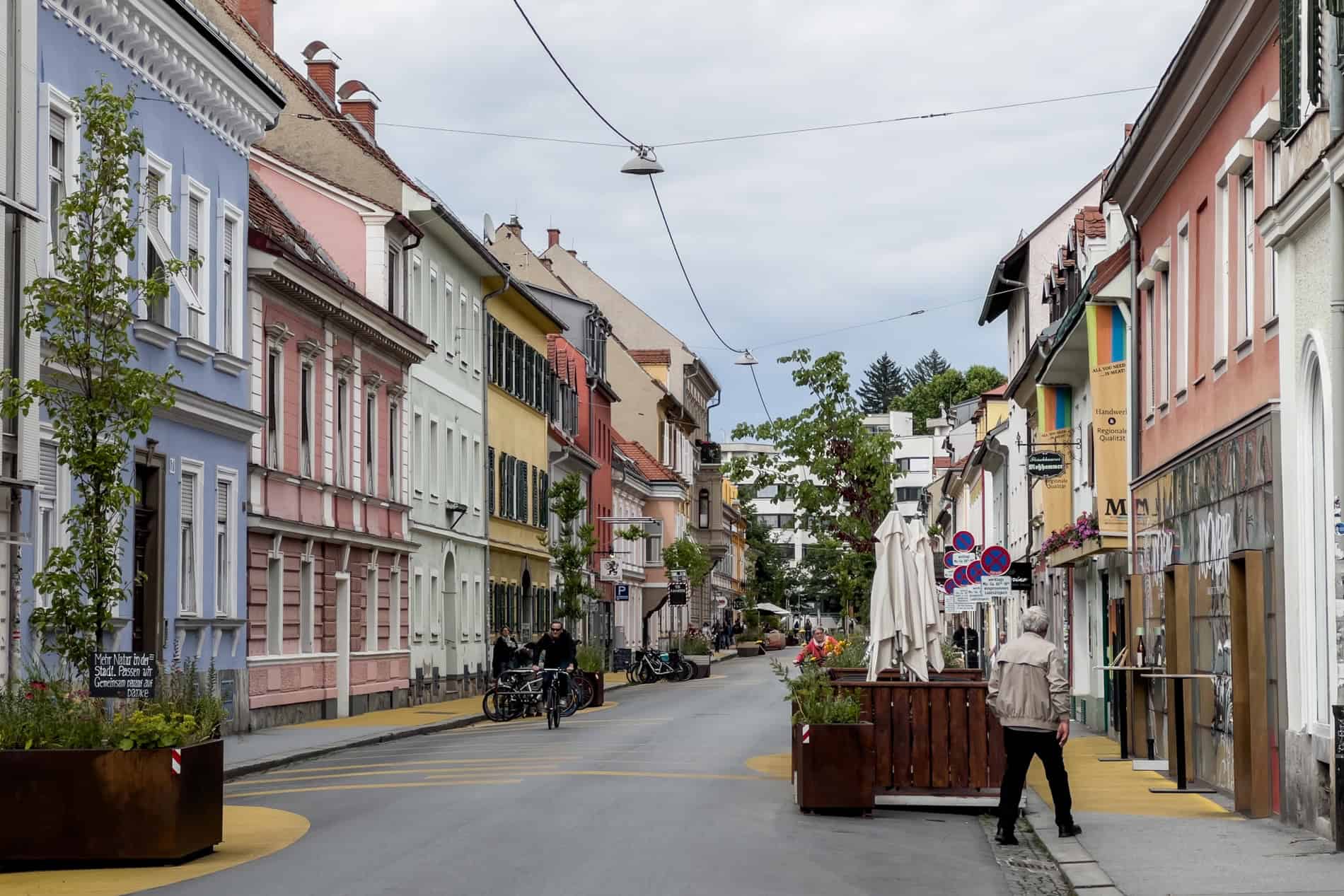 Multicoloured houses and yellow painted pavements of the Geidorf neighbourhood Graz.